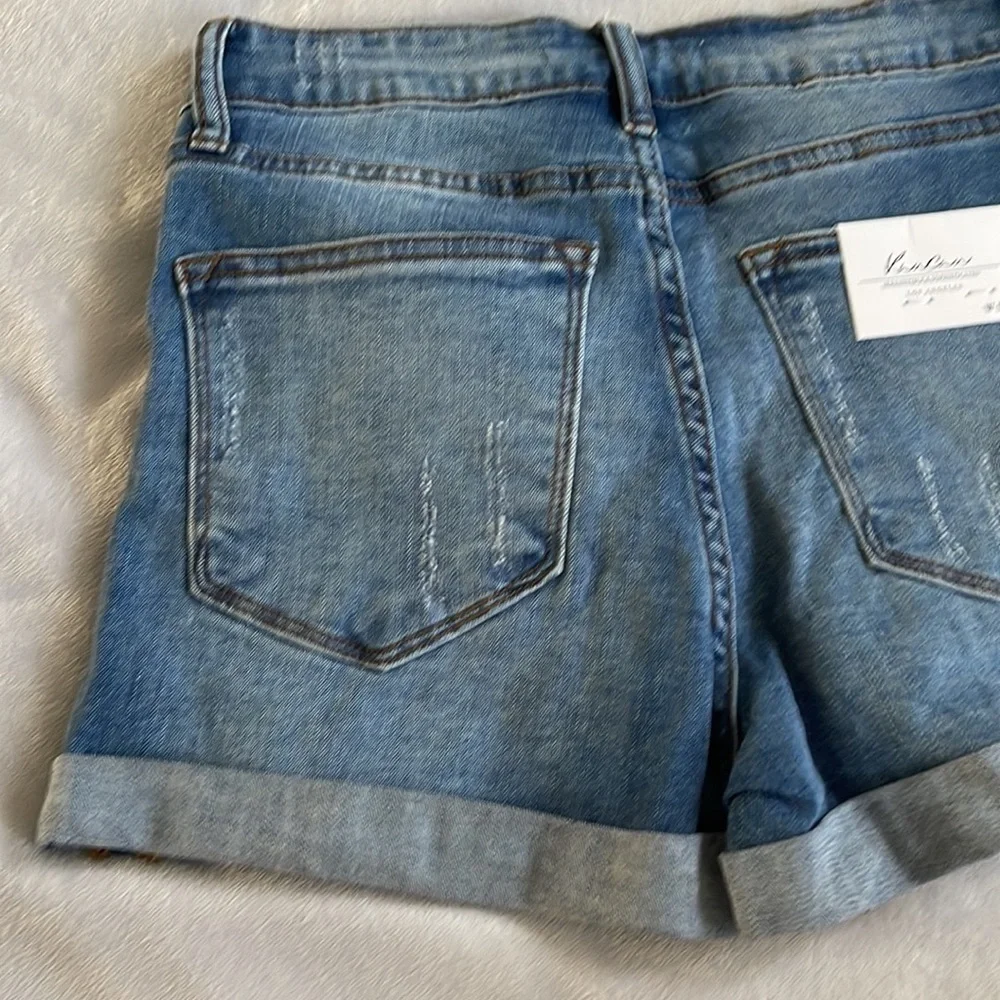 Kancan mid rise medium wash distressed five pocket size 5 size 26 jean shorts